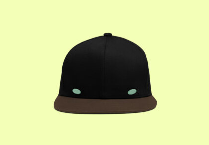 Chico's face as a hat black with green eyes and a brown bill